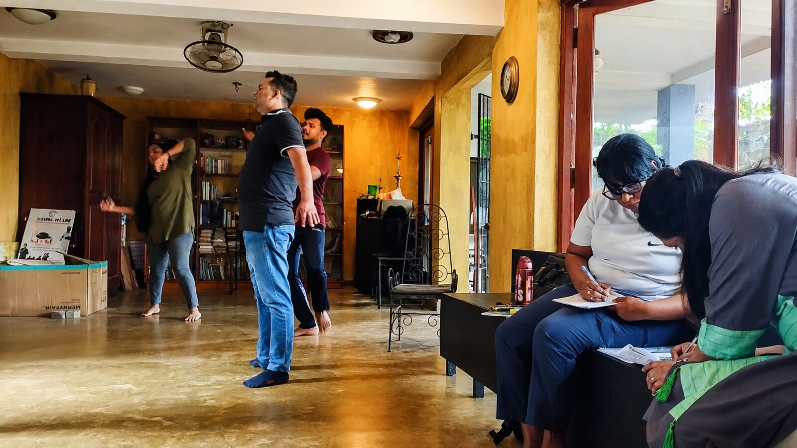 Participants engaging in a drama-based role activity